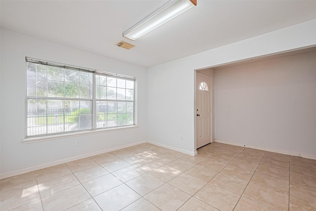 10111 Woodico Ct, Houston, TX 77038 - spare room with light tile patterned floors and baseboards