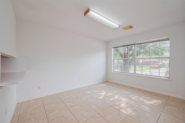 10111 Woodico Ct, Houston, TX 77038 - unfurnished room with light tile patterned flooring and baseboards