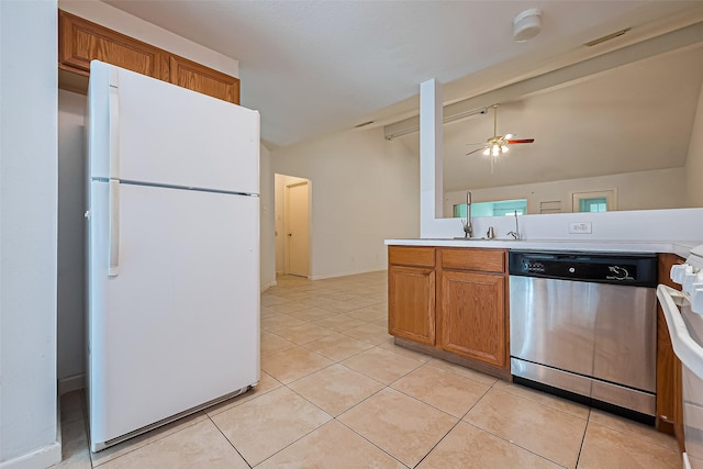 10111 Woodico Ct, Houston, TX 77038 - kitchen with freestanding refrigerator, stainless steel dishwasher, ceiling fan, vaulted ceiling, and light tile patterned flooring
