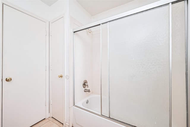 10111 Woodico Ct, Houston, TX 77038 - bathroom with shower / bath combination with glass door and tile patterned flooring