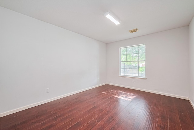 10111 Woodico Ct, Houston, TX 77038 - spare room featuring dark wood finished floors and baseboards