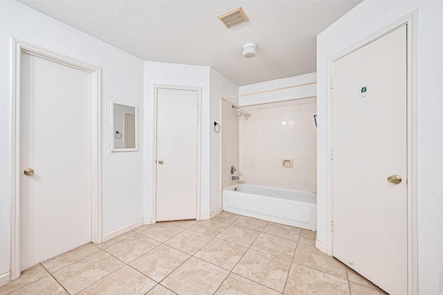 10111 Woodico Ct, Houston, TX 77038 - full bathroom with bathtub / shower combination, tile patterned flooring, and a textured ceiling