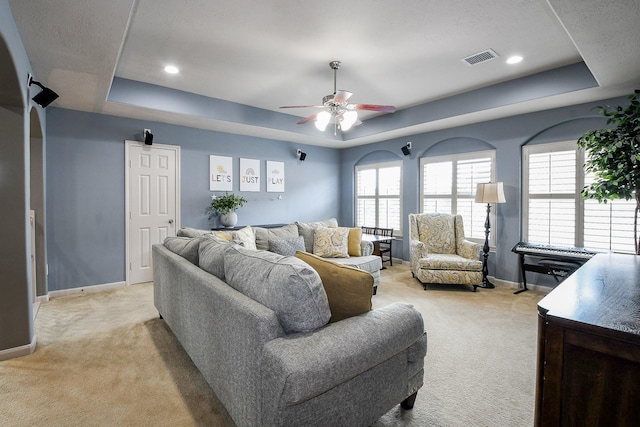8423 Glenn Leigh Dr NE, Spring, TX 77379 - living area featuring a tray ceiling, light colored carpet, and recessed lighting