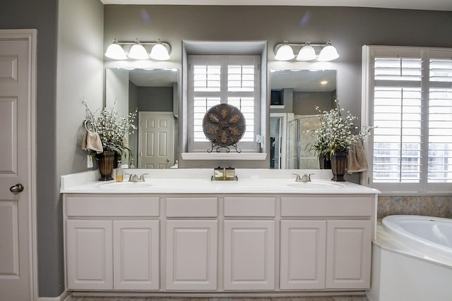 8423 Glenn Leigh Dr NE, Spring, TX 77379 - full bath featuring a shower stall, a bath, double vanity, and plenty of natural light