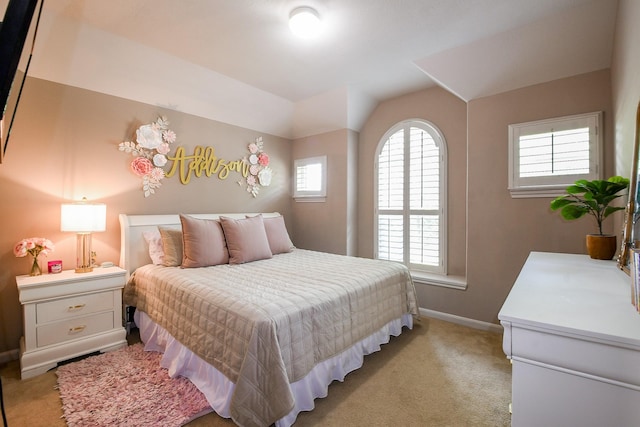 8423 Glenn Leigh Dr NE, Spring, TX 77379 - bedroom featuring light carpet, baseboards, and vaulted ceiling
