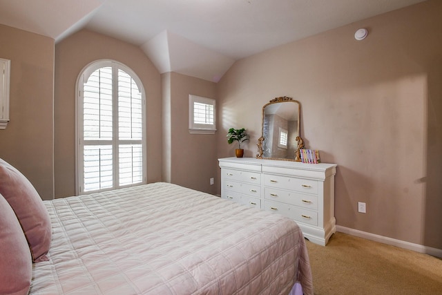 8423 Glenn Leigh Dr NE, Spring, TX 77379 - bedroom featuring light colored carpet, baseboards, and vaulted ceiling