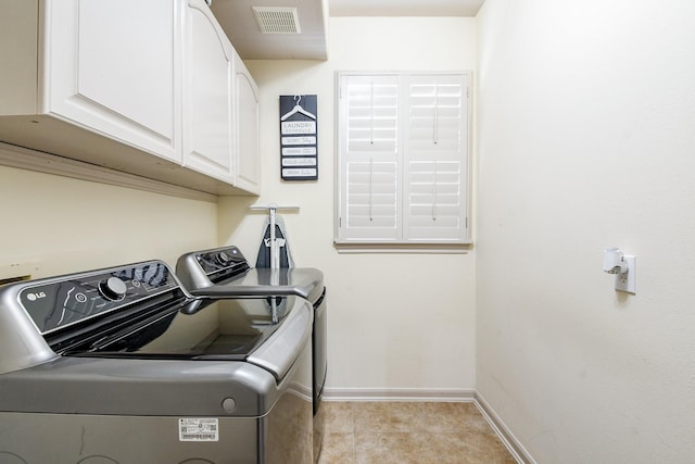 8423 Glenn Leigh Dr NE, Spring, TX 77379 - laundry room featuring cabinet space, washer and dryer, and baseboards