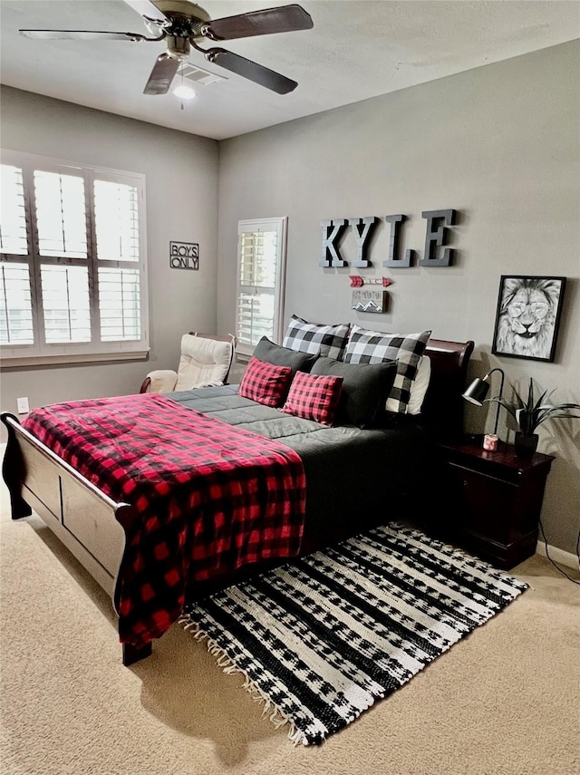 8423 Glenn Leigh Dr NE, Spring, TX 77379 - bedroom featuring carpet floors and a ceiling fan