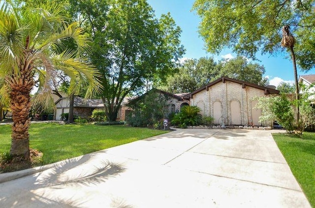 9719 Lawngate Dr, Houston, TX 77080 - view of front of property with a front lawn and driveway