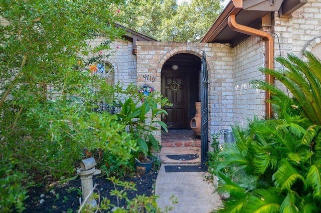 9719 Lawngate Dr, Houston, TX 77080 - view of exterior entry with stone siding and brick siding