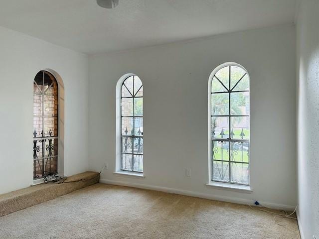 9719 Lawngate Dr, Houston, TX 77080 - unfurnished room with healthy amount of natural light and light colored carpet
