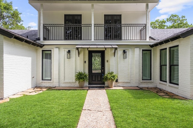 15414 Ashburton Dr, Jersey Village, TX 77040 - view of exterior entry featuring a balcony and brick siding