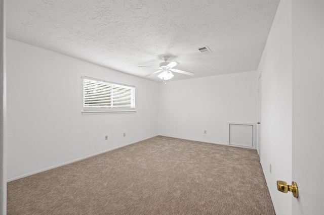 15414 Ashburton Dr, Jersey Village, TX 77040 - carpeted empty room featuring a ceiling fan and a textured ceiling