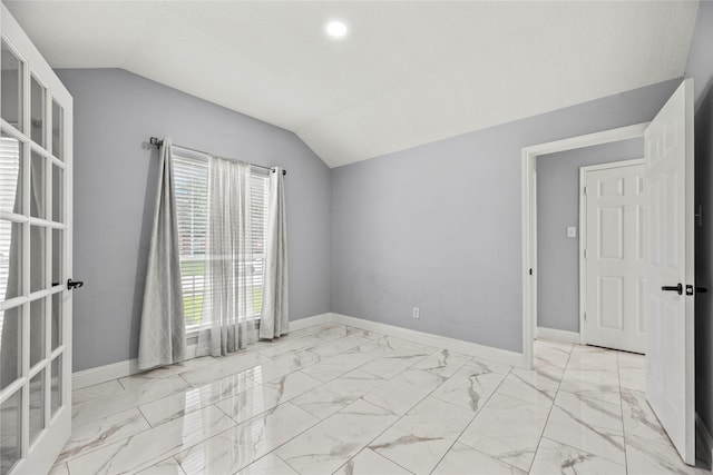 4130 Tree Moss Pl, Humble, TX 77346 - unfurnished room with lofted ceiling, light marble finish flooring, and baseboards