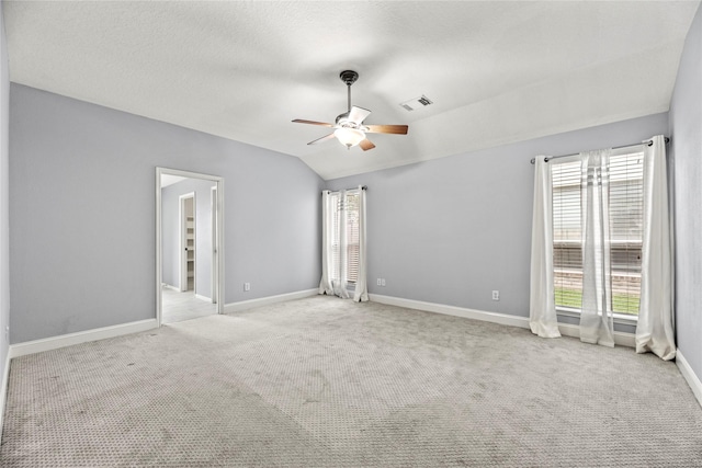 4130 Tree Moss Pl, Humble, TX 77346 - unfurnished bedroom featuring carpet floors, lofted ceiling, baseboards, and ceiling fan