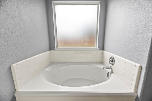 4130 Tree Moss Pl, Humble, TX 77346 - bathroom with a bath and a textured wall