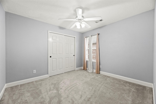 4130 Tree Moss Pl, Humble, TX 77346 - unfurnished bedroom featuring carpet floors, baseboards, a closet, and a ceiling fan
