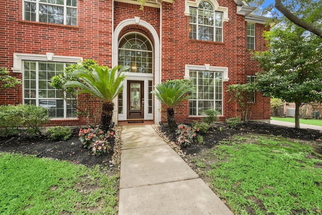 9607 Woodcliff Lake Dr, Spring, TX 77379 - doorway to property with brick siding