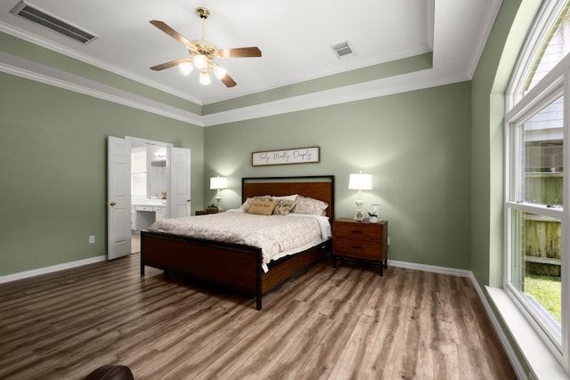9607 Woodcliff Lake Dr, Spring, TX 77379 - bedroom with wood finished floors, baseboards, ornamental molding, and ceiling fan