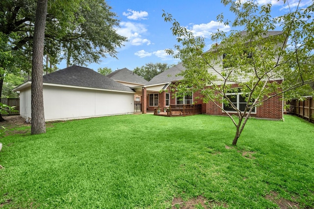 9607 Woodcliff Lake Dr, Spring, TX 77379 - back of house with brick siding and a wooden deck