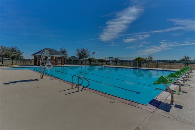 9607 Woodcliff Lake Dr, Spring, TX 77379 - community pool with a patio