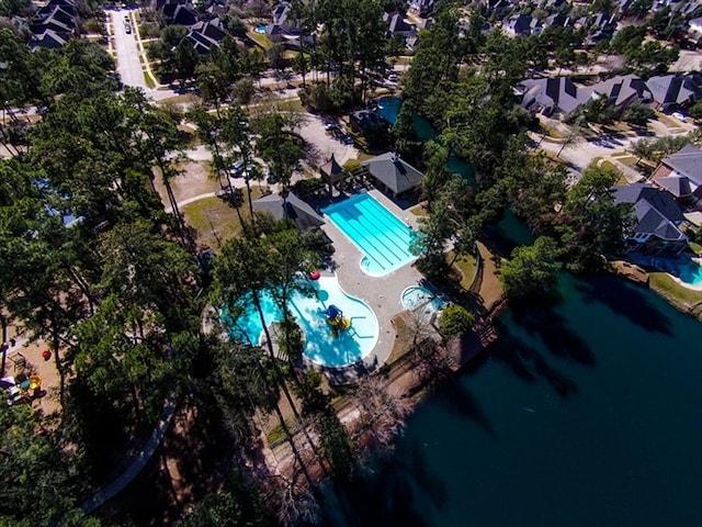 9607 Woodcliff Lake Dr, Spring, TX 77379 - aerial view of property's location featuring a pool area, nearby suburban area, and a large body of water