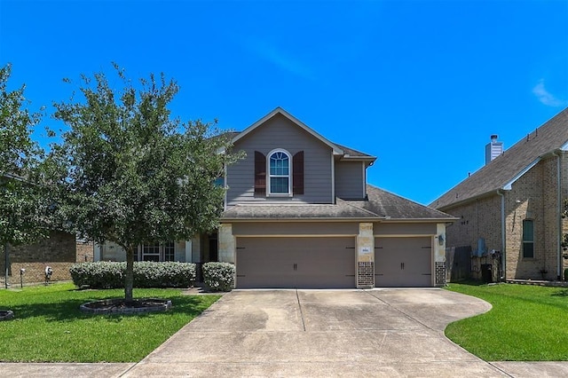 9911 Clear Diamond Dr, Rosharon, TX 77583 - view of front of property featuring a front yard, driveway, a garage, and a shingled roof