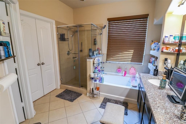 9911 Clear Diamond Dr, Rosharon, TX 77583 - full bathroom with a stall shower, a bath, tile patterned flooring, and vanity