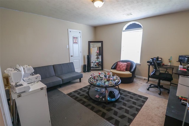 9911 Clear Diamond Dr, Rosharon, TX 77583 - carpeted living room featuring a desk and a textured ceiling
