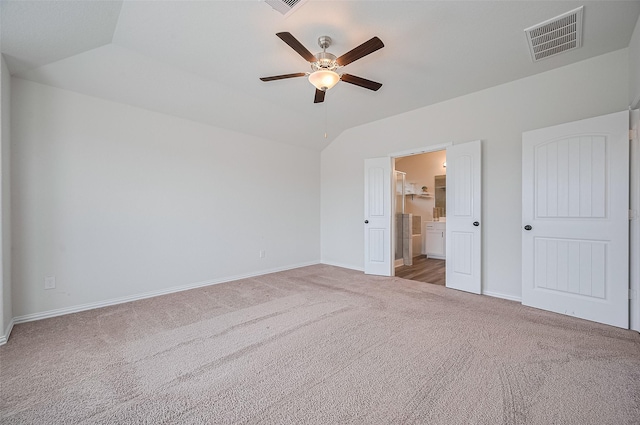 20231 Creekdale Bend Dr, Cypress, TX 77433 - unfurnished bedroom with carpet floors, baseboards, lofted ceiling, ensuite bath, and a ceiling fan