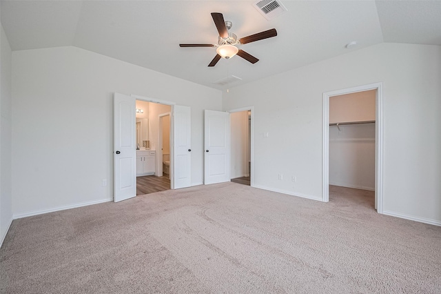 20231 Creekdale Bend Dr, Cypress, TX 77433 - unfurnished bedroom featuring lofted ceiling, carpet floors, a spacious closet, baseboards, and a closet