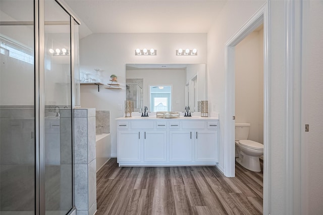 20231 Creekdale Bend Dr, Cypress, TX 77433 - full bath featuring double vanity, wood finished floors, a shower stall, a bath, and toilet