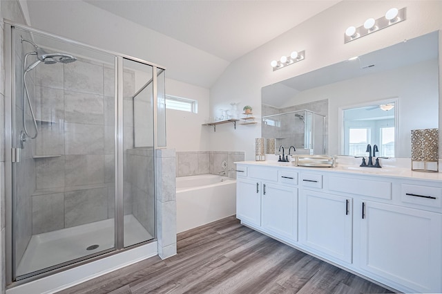 20231 Creekdale Bend Dr, Cypress, TX 77433 - bathroom featuring double vanity, a garden tub, a shower stall, healthy amount of natural light, and vaulted ceiling