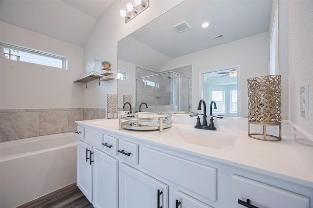 20231 Creekdale Bend Dr, Cypress, TX 77433 - full bathroom with vaulted ceiling, double vanity, a stall shower, a garden tub, and plenty of natural light
