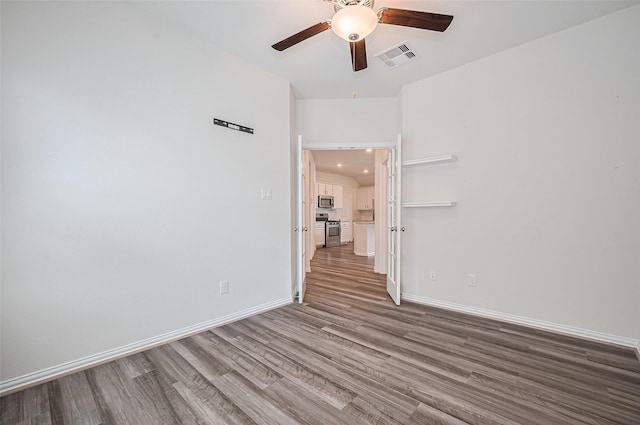 20231 Creekdale Bend Dr, Cypress, TX 77433 - empty room with wood finished floors, ceiling fan, baseboards, and recessed lighting