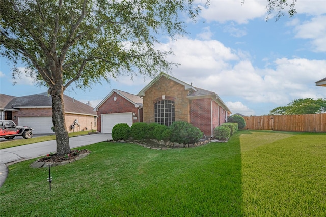 13409 Timberoak Ct, Rosharon, TX 77583 - view of front facade with concrete driveway, brick siding, an attached garage, and stone siding