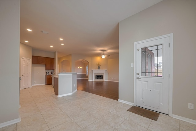 13409 Timberoak Ct, Rosharon, TX 77583 - entrance foyer featuring arched walkways, a ceiling fan, recessed lighting, baseboards, and light tile patterned floors