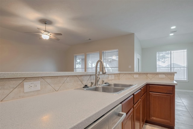 13409 Timberoak Ct, Rosharon, TX 77583 - kitchen with a sink, brown cabinets, tasteful backsplash, light countertops, and dishwasher