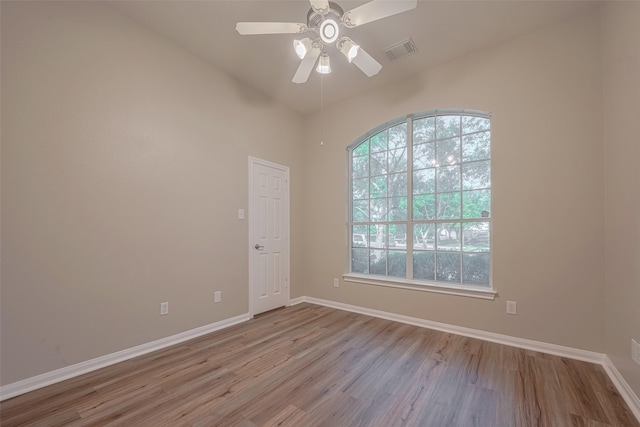 13409 Timberoak Ct, Rosharon, TX 77583 - empty room featuring wood finished floors, a ceiling fan, and baseboards