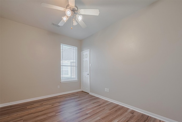 13409 Timberoak Ct, Rosharon, TX 77583 - spare room featuring light wood-style flooring, baseboards, and a ceiling fan