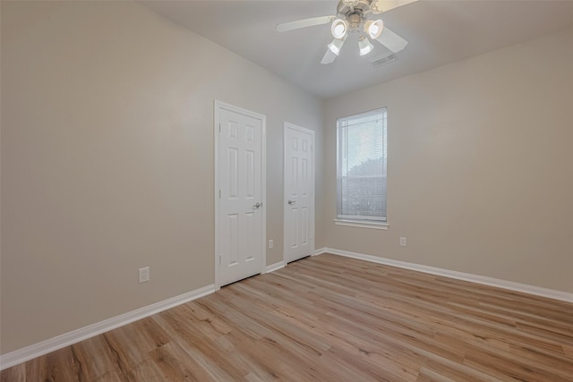 13409 Timberoak Ct, Rosharon, TX 77583 - unfurnished bedroom with light wood-type flooring, baseboards, and ceiling fan