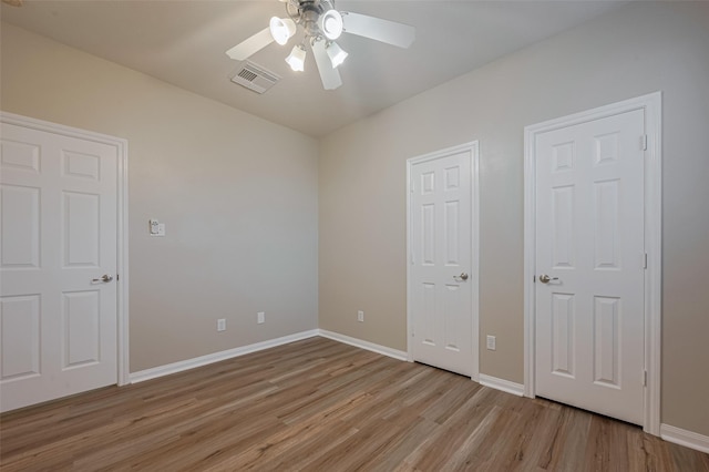 13409 Timberoak Ct, Rosharon, TX 77583 - unfurnished bedroom with light wood-style flooring, baseboards, and a ceiling fan