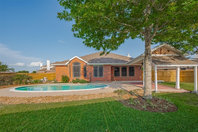 13409 Timberoak Ct, Rosharon, TX 77583 - rear view of house featuring brick siding, a patio, and roof with shingles