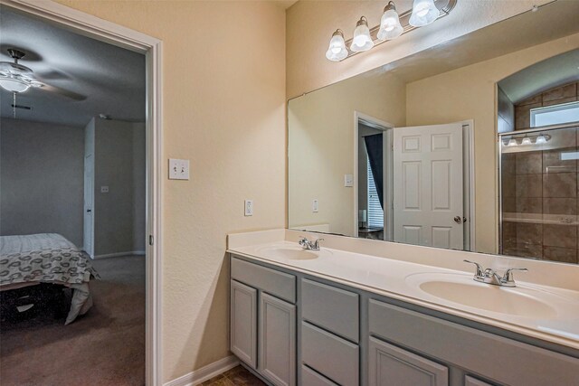 2927 Coachmaker Trl, Rosenberg, TX 77471 - full bathroom with double vanity, ceiling fan, and a tile shower