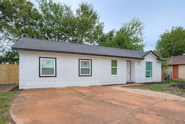 12111 Jutland Rd, Houston, TX 77048 - ranch-style home with a patio area and a shingled roof