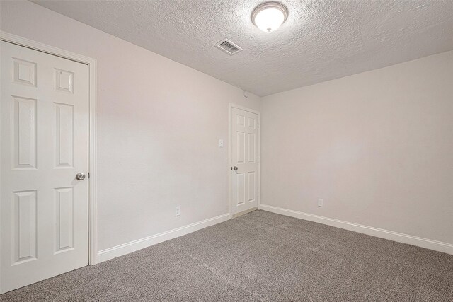 12111 Jutland Rd, Houston, TX 77048 - unfurnished room with carpet floors, baseboards, and a textured ceiling