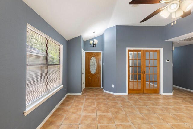 14 W Cobble Hill Cir, The Woodlands, TX 77381 - foyer entrance featuring lofted ceiling, french doors, light tile patterned flooring, a chandelier, and a ceiling fan