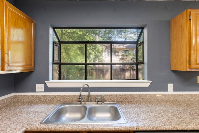 14 W Cobble Hill Cir, The Woodlands, TX 77381 - kitchen featuring a sink, light countertops, and plenty of natural light