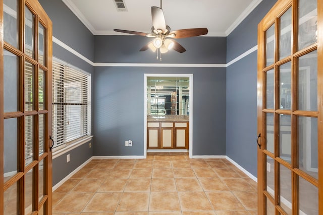 14 W Cobble Hill Cir, The Woodlands, TX 77381 - empty room with french doors, crown molding, a ceiling fan, baseboards, and light tile patterned floors