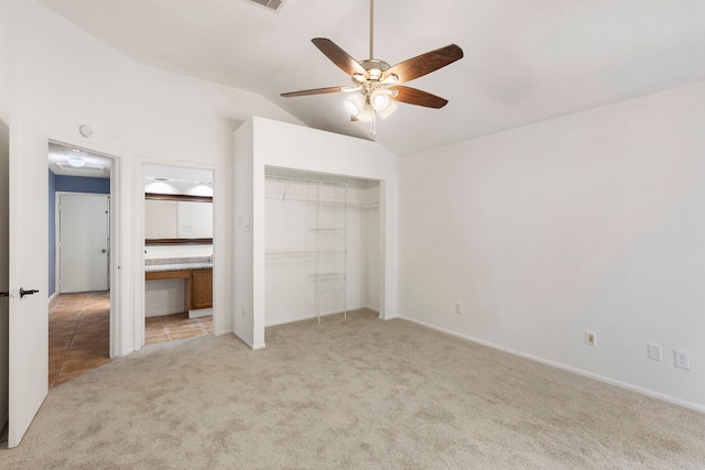 14 W Cobble Hill Cir, The Woodlands, TX 77381 - unfurnished bedroom with light colored carpet, lofted ceiling, a closet, ensuite bathroom, and ceiling fan